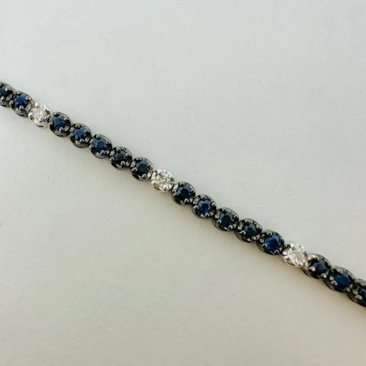18K White Gold Tennis Bracelet with 51 Sapphires and 10 Diamonds