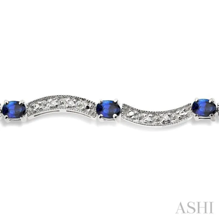 4x3mm Oval Cut Sapphire and 1/10 Ctw Single Cut Diamond Bracelet in 14K White Gold