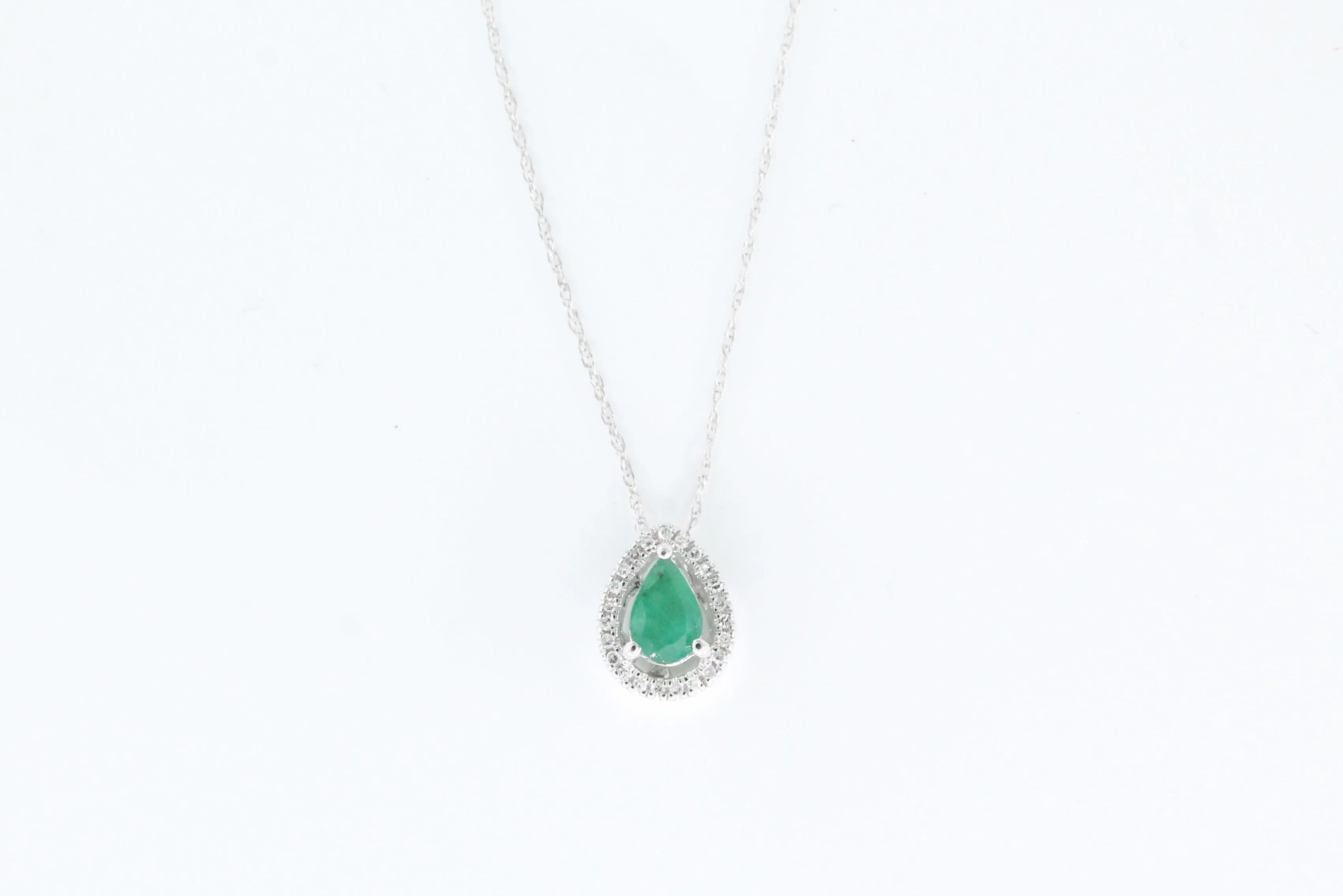 White Gold Emerald and Diamond Halo Pendant with Chain